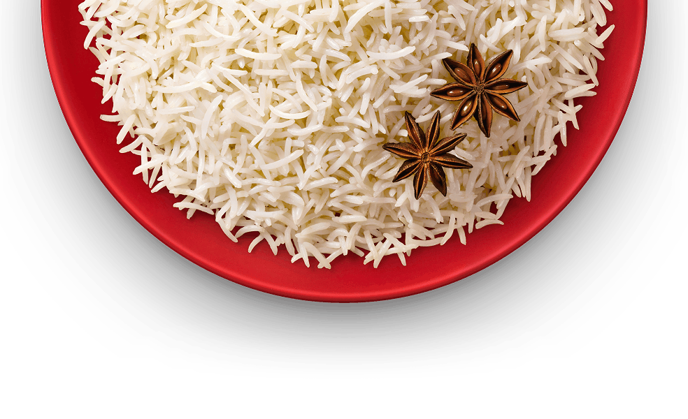 Cooked Royal Authentic Basmati Rice served on a red plate, garnished with star anise