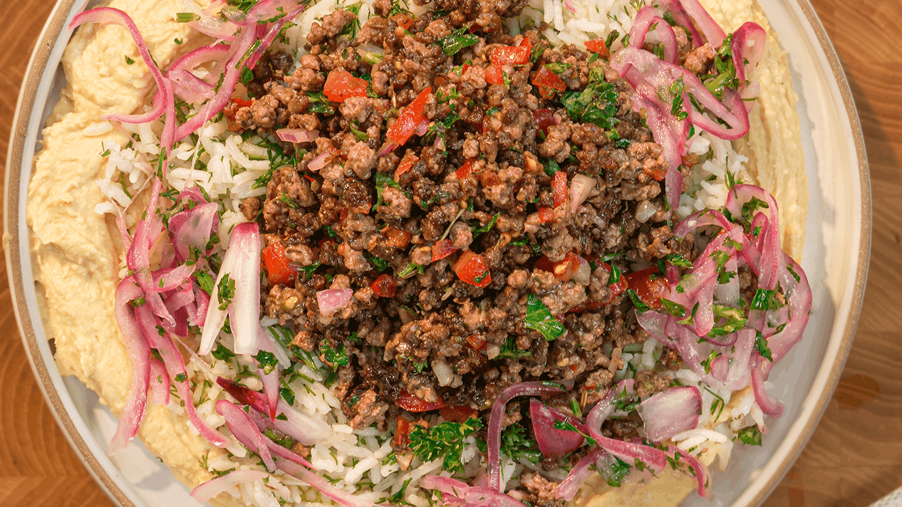 A Ground Beef Gyro & Creamy Hummus Rice Bowl made with fluffy Royal Basmati Rice, topped with seasoned ground beef, creamy hummus, fresh herbs, and tangy pickled red onions, served in a Mediterranean-inspired bowl - Video cover