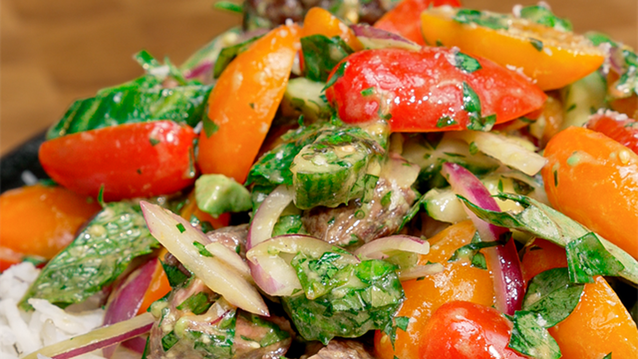 Summer Steak Salad Rice Bowl made with Royal Authentic Basmati Rice, topped with juicy grilled steak, cherry tomatoes, cucumber, red onion, fresh herbs, and a vibrant lime Dijon dressing, served in a rustic bowl for a fresh, colorful, and satisfying summer meal.